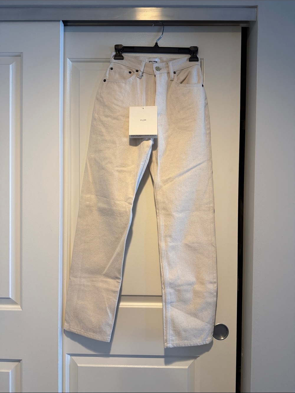 STILL HERE. Bone color “childhood jeans” with brown stripe. size 24. NWT